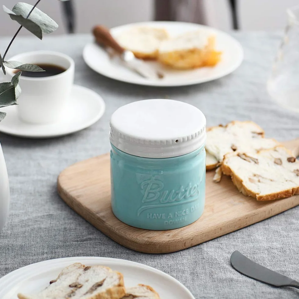 DOWAN Burriera in Porcellana, Portaburro in Porcellana, Burriera Stile Barattolo di Vetro con Coperchio e Acqua, Morbido e Distribuibile, Gadget da Cucina, Blu