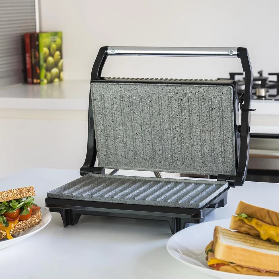 Cecotec Griglia elettrica con Grill Rock'n Grill. 700 W, superficie 23 x 14,5 cm, RockStone antiaderente, senza PTFE, PFOA, piastra galleggiante, maniglia fredda al tatto, indicatore luminoso