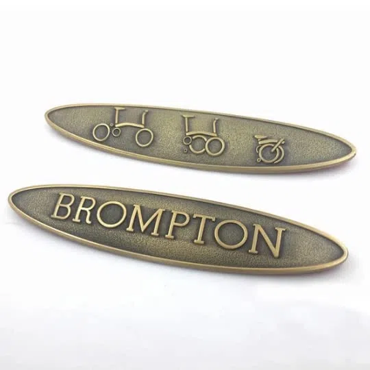 2 x decalcomanie metalliche in rilievo per adesivo metallico Brompton in bronzo laccato grezzo
